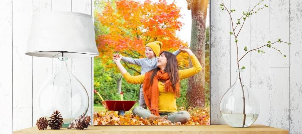 How to Clean a Canvas Print. Beautiful photo canvas print with mother and child in autumnal setting..
