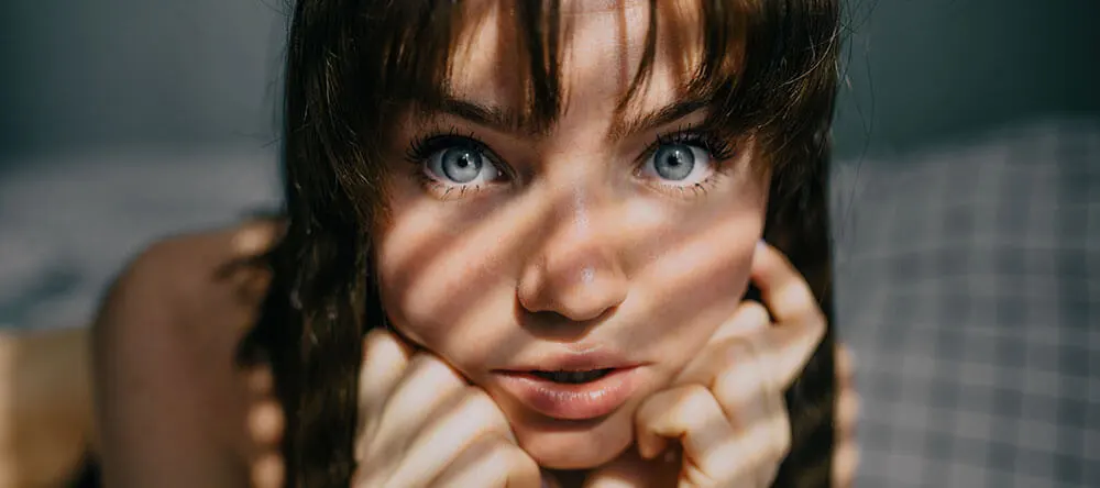 women with brown hair and blue eyes